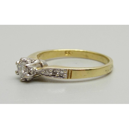 939 - An 18ct gold and diamond solitaire ring with diamond shoulders, 0.3ct diamond weight, 3.6g, O