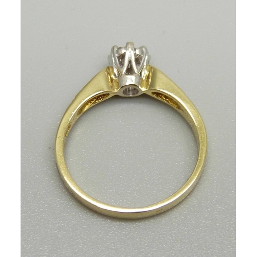 939 - An 18ct gold and diamond solitaire ring with diamond shoulders, 0.3ct diamond weight, 3.6g, O