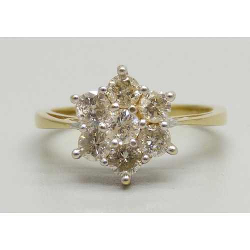 941 - An 18ct gold, seven stone brilliant cut diamond cluster ring, 0.96ct total diamond weight, 3.7g, M