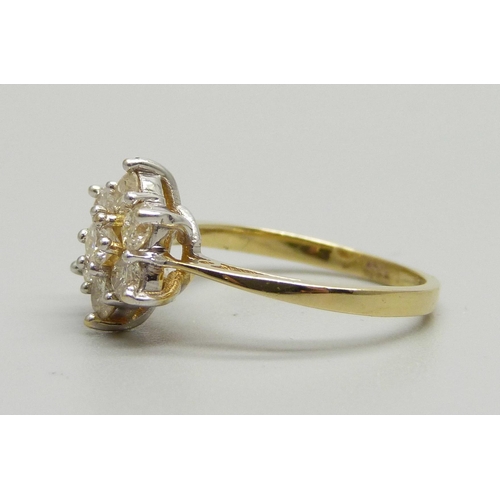 941 - An 18ct gold, seven stone brilliant cut diamond cluster ring, 0.96ct total diamond weight, 3.7g, M