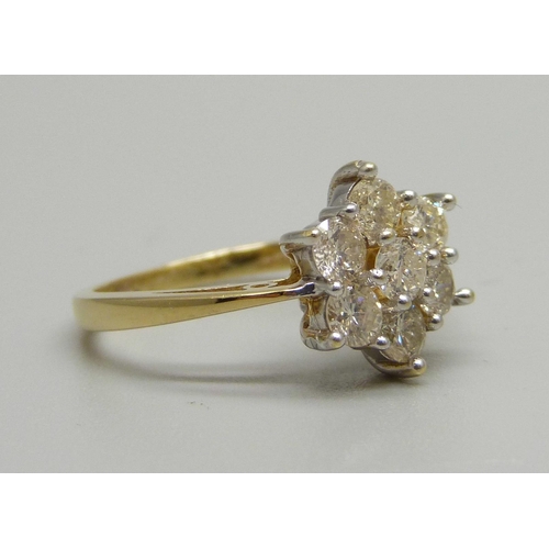 941 - An 18ct gold, seven stone brilliant cut diamond cluster ring, 0.96ct total diamond weight, 3.7g, M