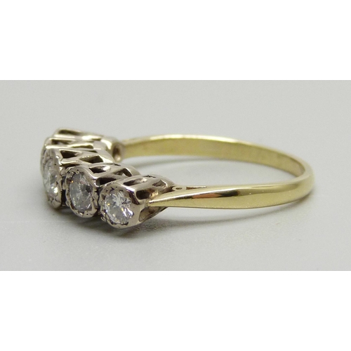 942 - An 18ct gold, five stone diamond ring, Sheffield 1979, 0.75ct diamond weight, 4g, R