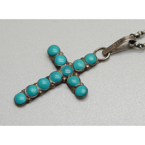 946 - A silver and turquoise cross pendant on chain, (loop of pendant marked Mexico)