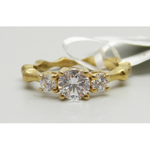 957 - A silver gilt Swarovski zirconia three stone ring, O