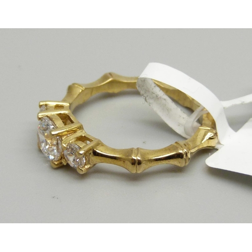 957 - A silver gilt Swarovski zirconia three stone ring, O