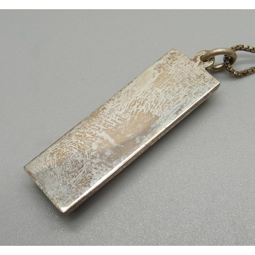 965 - A silver ingot pendant and chain, 35g