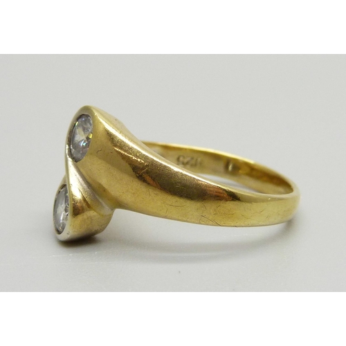 972 - A silver gilt diamond simulant crossover ring, S