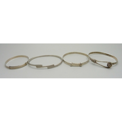 979 - Four silver bangles, 42g