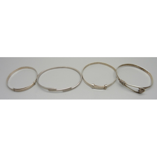 979 - Four silver bangles, 42g