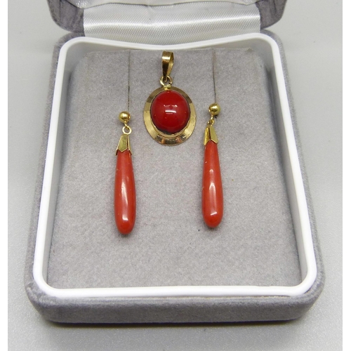 985 - An 18ct and coral pendant, 1.3g, and a pair of coral drop earrings