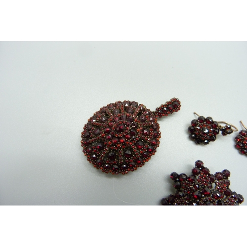 994 - Bohemian garnet set jewellery; brooch, earrings and pendant/picture locket, (pendant 38mm wide)