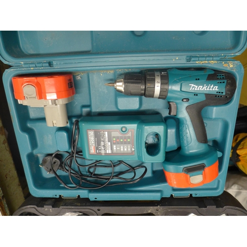 2014 - A Makita drill (model:- 8391D) with two batteries and Black and Decker angle grinder