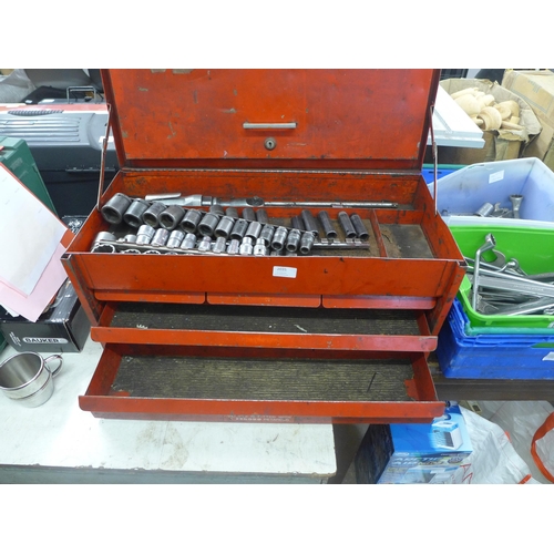 2035 - A red metal tool chest with approximately 70 assorted tools mostly sockets with socket set in tin ca... 