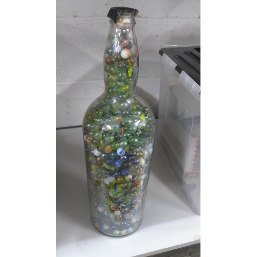 2070 - Bells Whisky bottle full of marbles