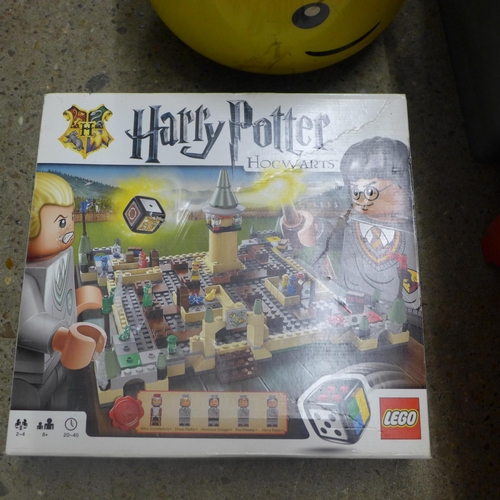 2075 - A quantity of LEGO, including Harry Potter and LEGO head storage box