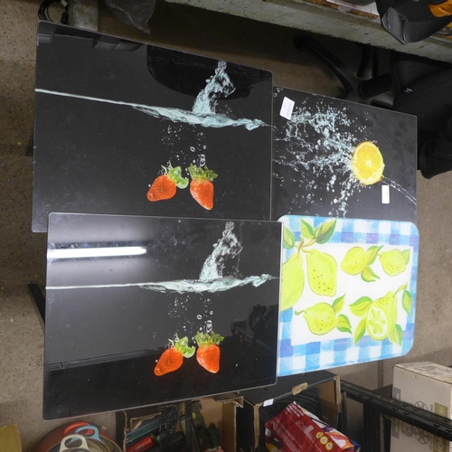 2101 - Four glass chopping boards