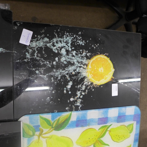 2101 - Four glass chopping boards