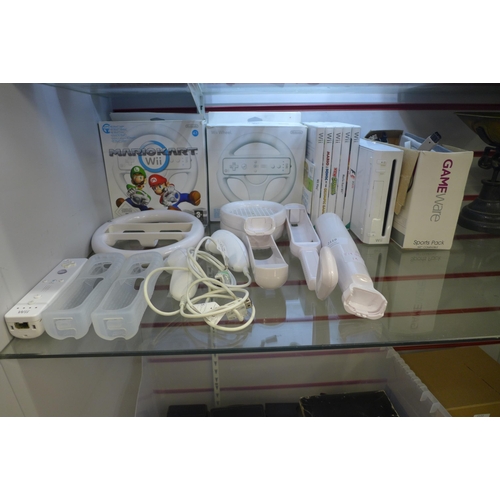 2119 - A Wii console with games and accessories