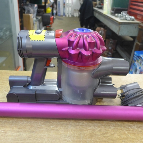 2126 - A Dyson DCV7 Motorhead vacuum cleaner with charging wall mount