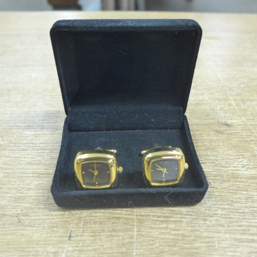 2142 - A pair of watch cufflinks