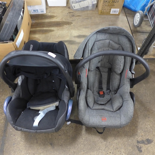 2416 - Two baby carriers/car seaters including Maxi-Cosi