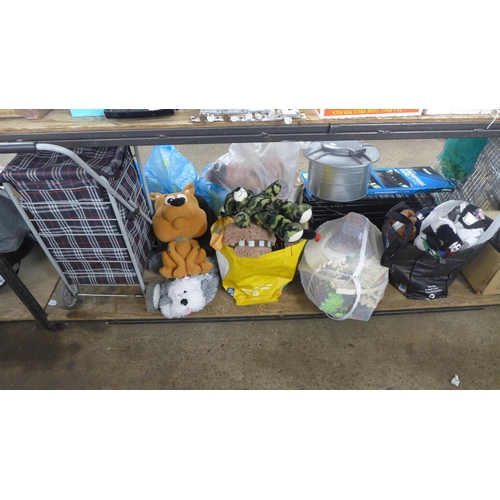 2420 - A large quantity of toys including soft toys, a train set, etc.