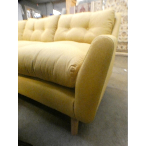 1497 - An ochre upholstered corner sofa