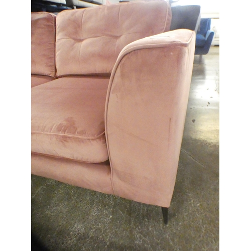 1503 - An Old Rose velvet upholstered three seater sofa on stiletto legs