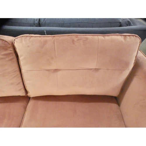 1503 - An Old Rose velvet upholstered three seater sofa on stiletto legs