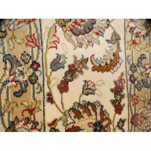 1544 - A large ivory ground full-pile cashmere carpet with all-over floral design (340cm x 240cm)