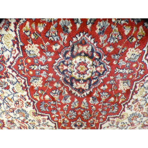 1545 - An ivory ground full pile cashmere runner with floral medallion design (300cm x 80cm)