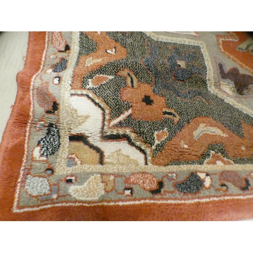 1564 - A rust patterned rug