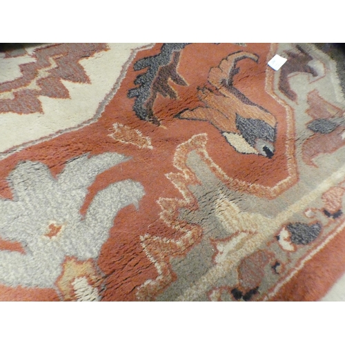 1564 - A rust patterned rug