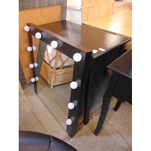 1606 - A black painted dressing table with illuminated mirror