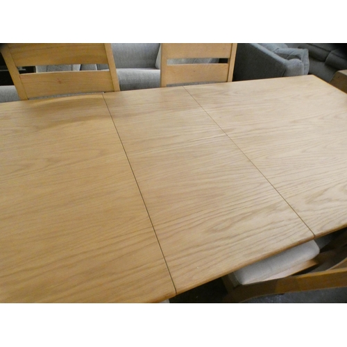 1303 - A Bonne Ash extending dining table and six chairs * this lot is subject to VAT