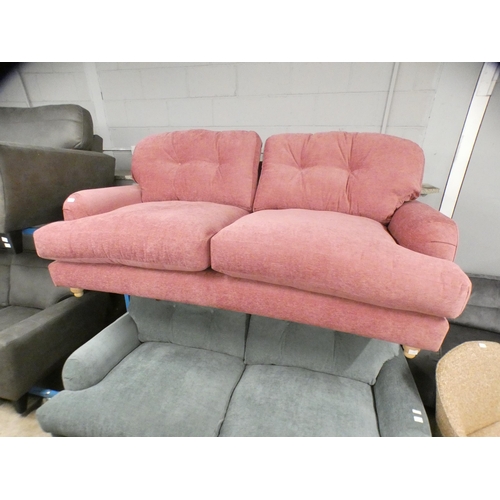 1442 - A sherbet upholstered three seater sofa on turned legs