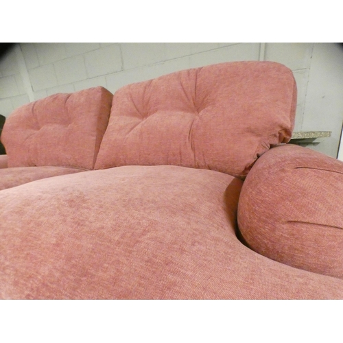 1442 - A sherbet upholstered three seater sofa on turned legs