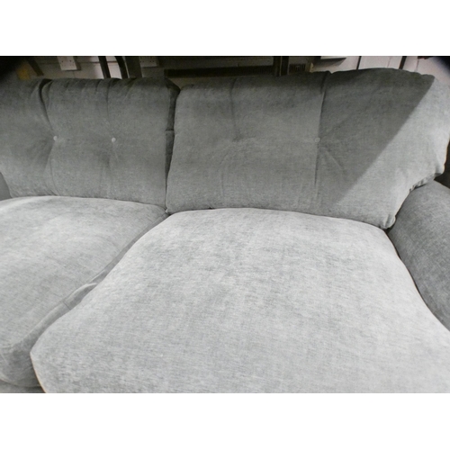 1443 - A teal upholstered three seater sofa on turned legs