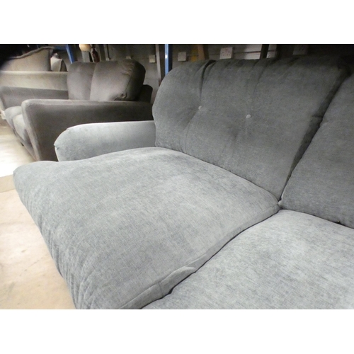 1443 - A teal upholstered three seater sofa on turned legs