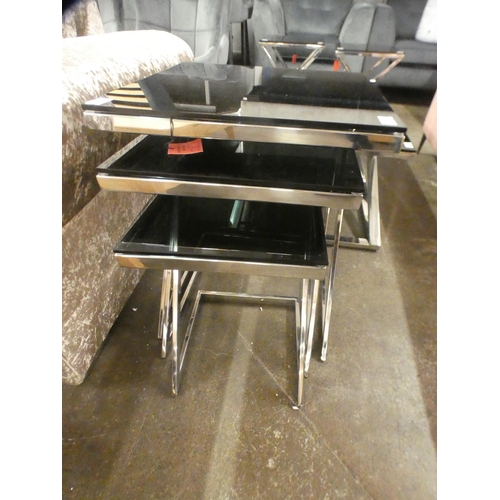 1505 - A black glass and chrome nest of tables * this lot is subject to VAT