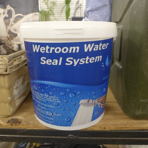 2352 - A tub containing a Nass wet room water sealant system