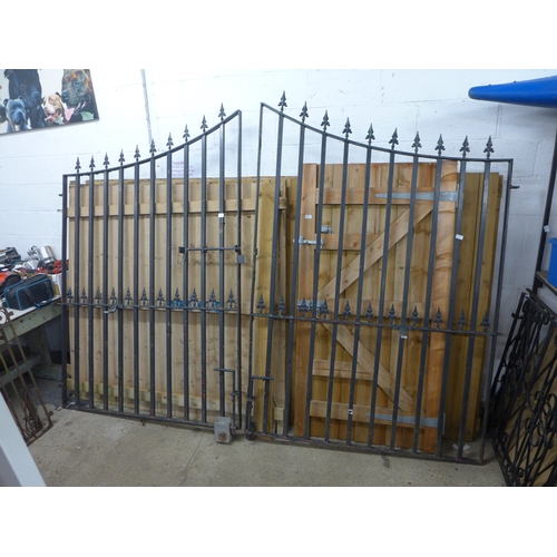 2432 - Wrought iron gates (approx. 7ft high x approx. 3m opening) with brackets for electric gate component... 