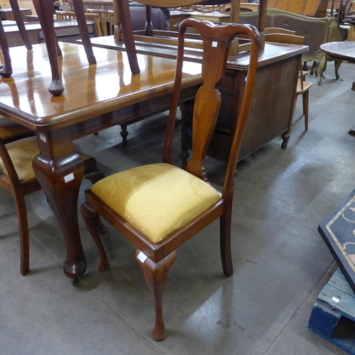 101 - An early 20th Century walnut dining table and six chairs