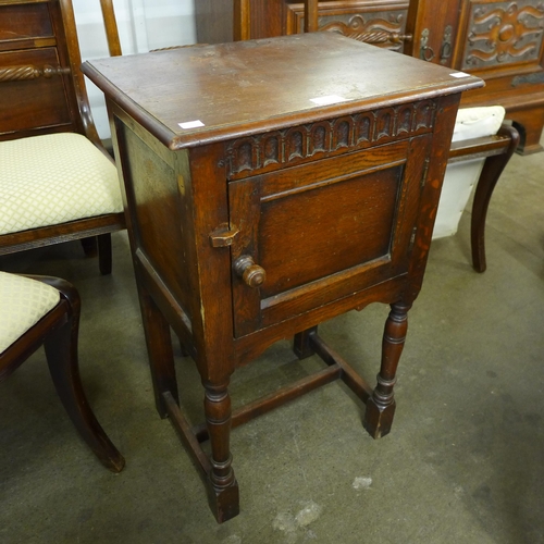 106 - A 17th Century style carved oak pot cupboard