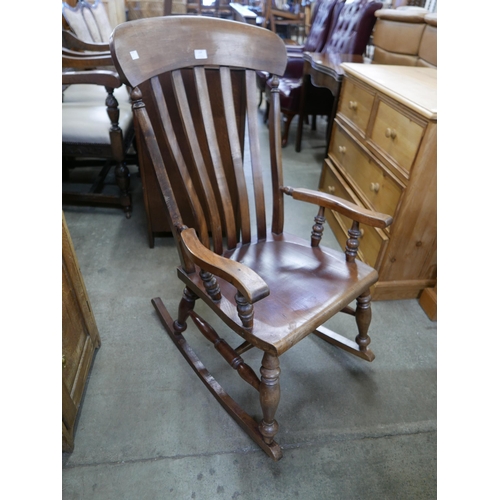 114 - A Victorian elm and beech farmhouse rocking chair