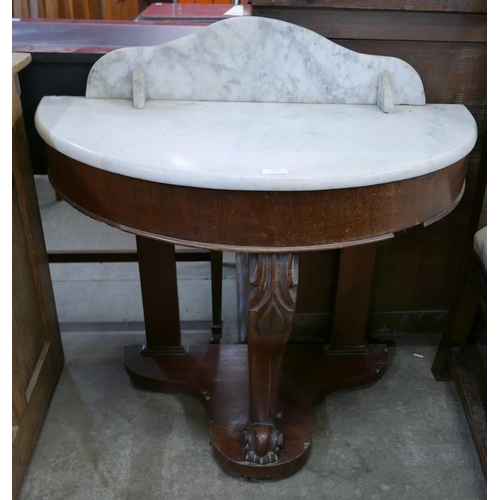 116 - A Victorian mahogany and marble topped demi-lune washstand