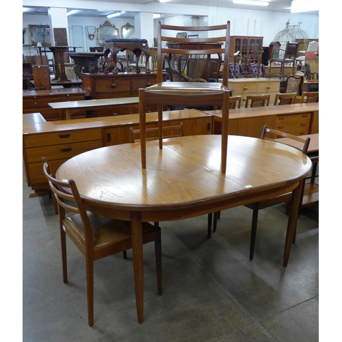 12 - A G-Plan Fresco teak extending dining table and four chairs