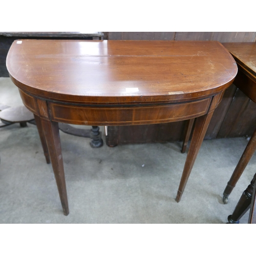 120 - A George III inlaid mahogany demi-lune fold over card table