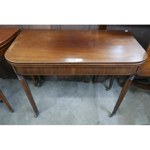 121 - A George IV inlaid mahogany D-shaped fold over tea table