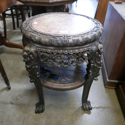 122 - A 19th Century Chinese carved padouk wood and marble topped jardiniere stand